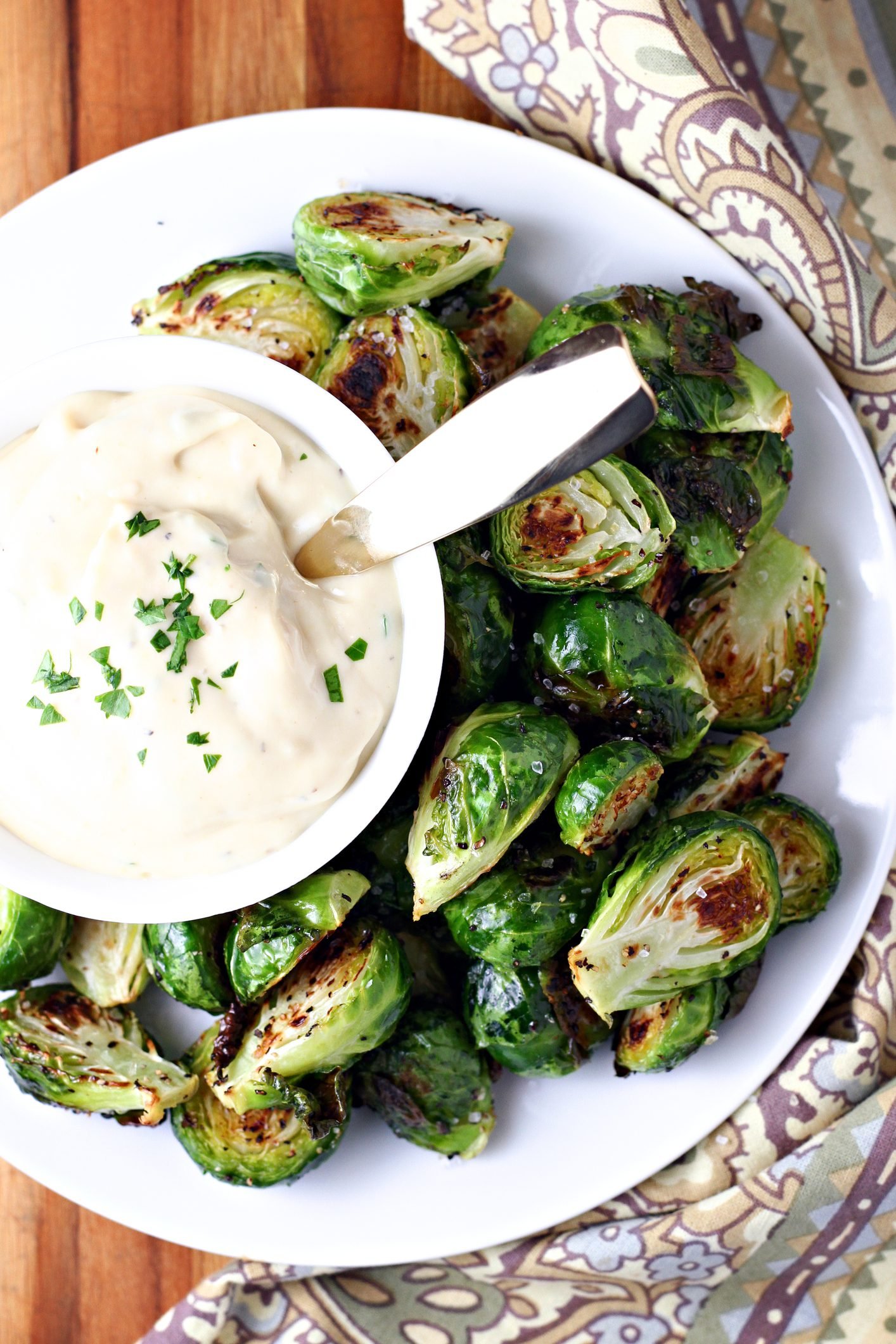 Roasted Brussels Sprouts Alongside a Tangy Garlic Sauce