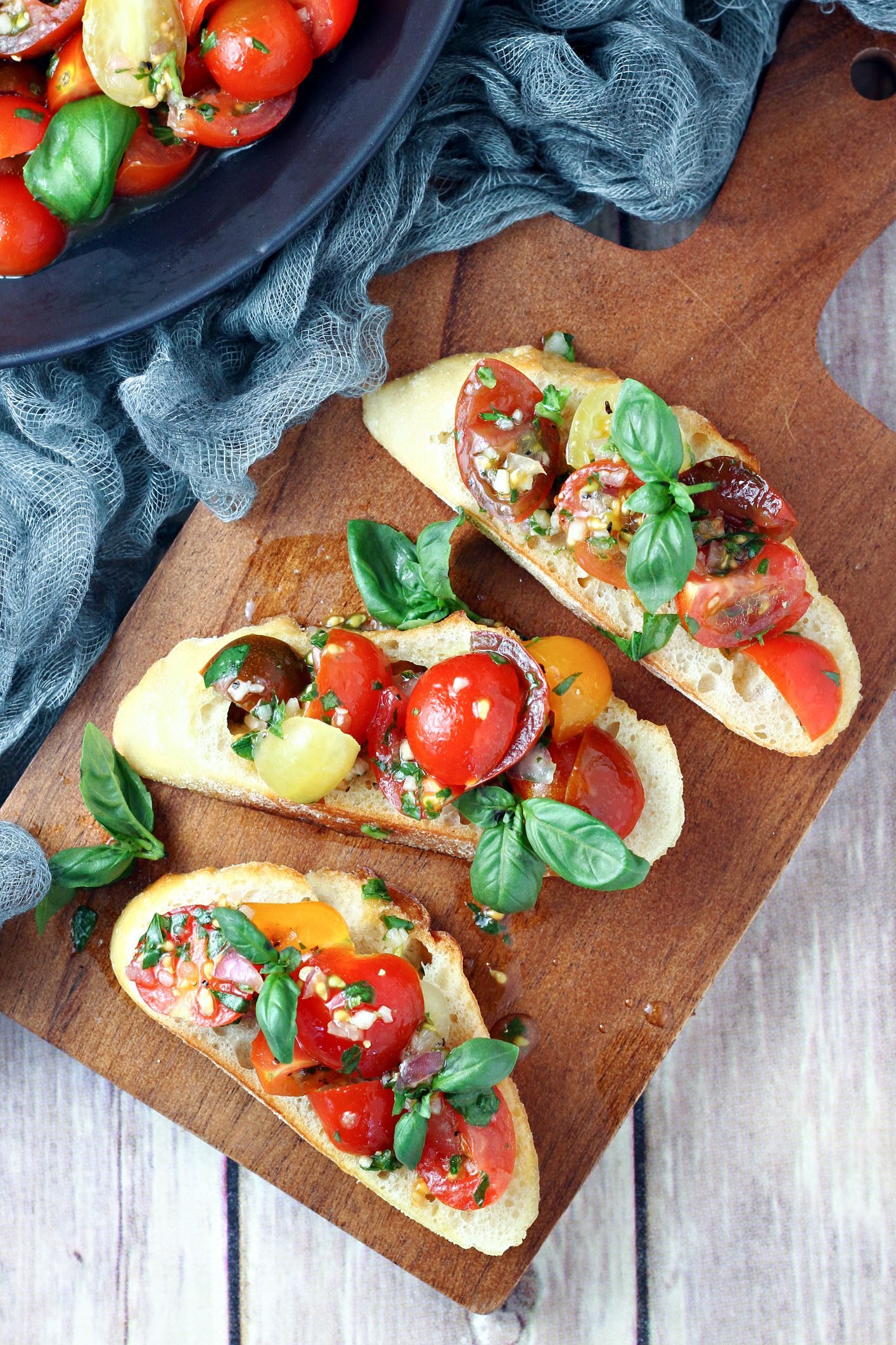 Crunchy Baguette Slices Crowned With Vibrant Tomatoes