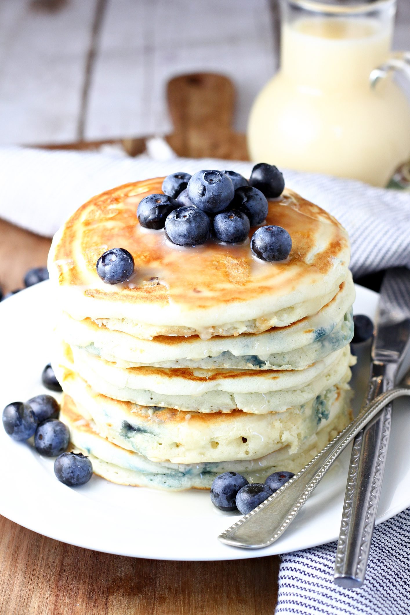 Towering Blueberry Pancakes Drizzled With Homemade Vanilla Syrup