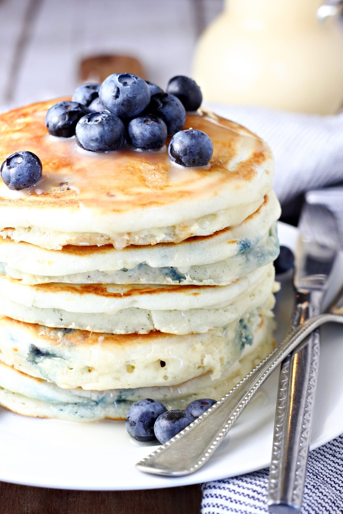 Towering Blueberry Pancakes Drizzled With Homemade Vanilla Syrup